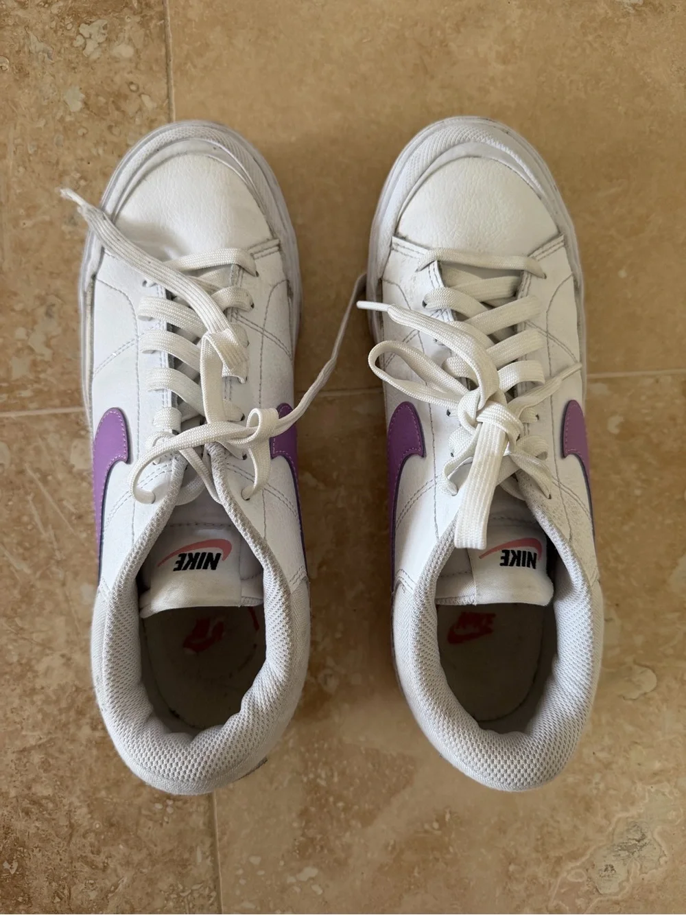 Nike Women’s White Low-Top Sneaker with Purple Swoosh Accent